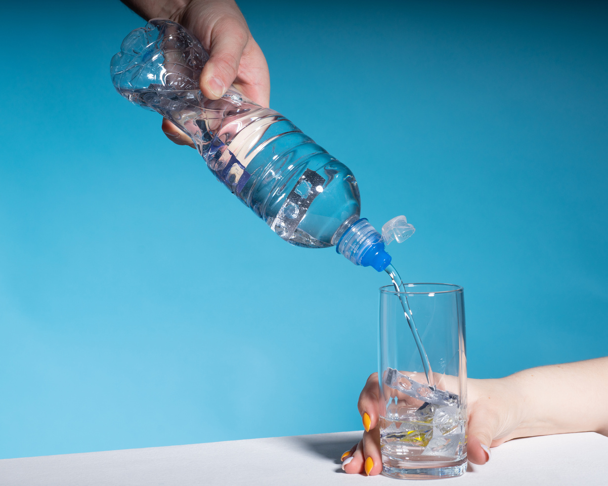 Water being poured into a drinking glass